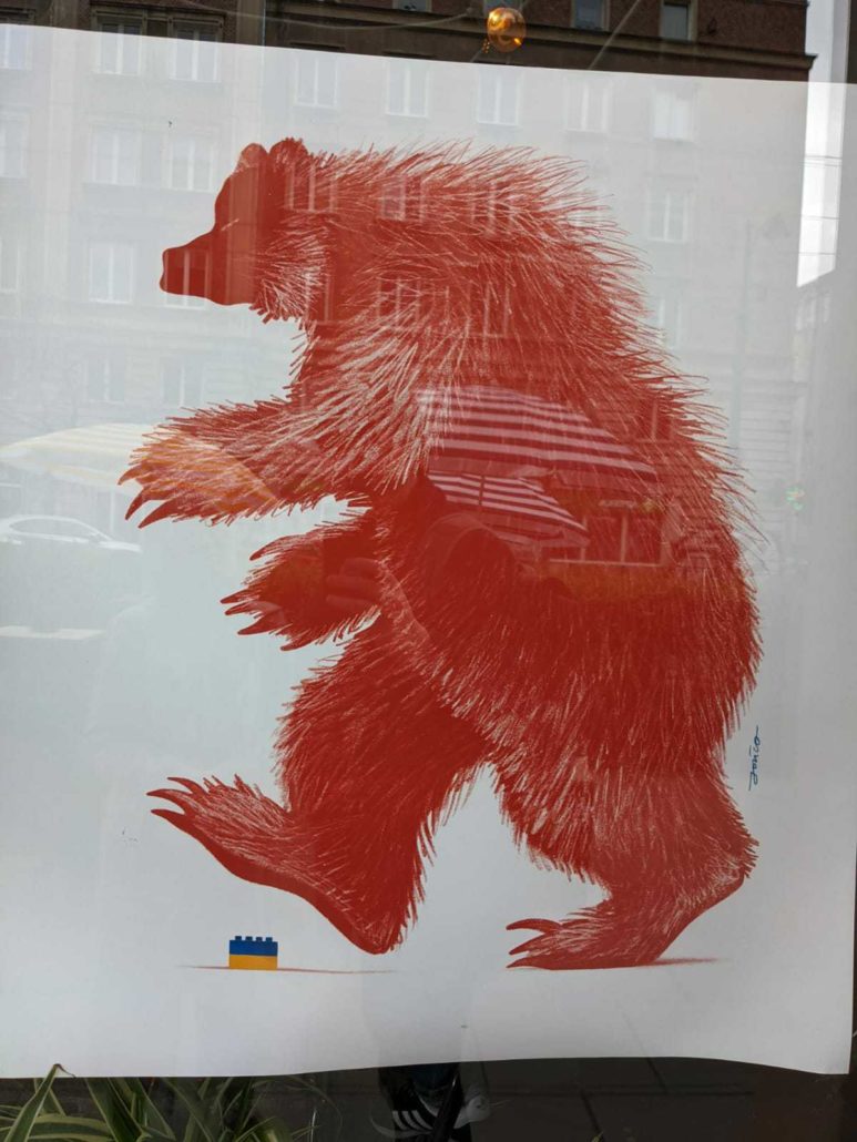Illustration of Russian bear stepping on a small Ukranian lego
